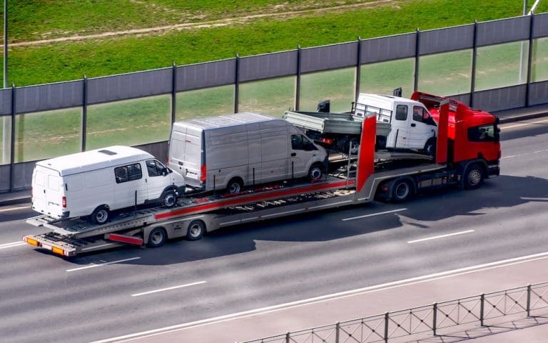 Hauling truck from Central Dispatch transporting cars